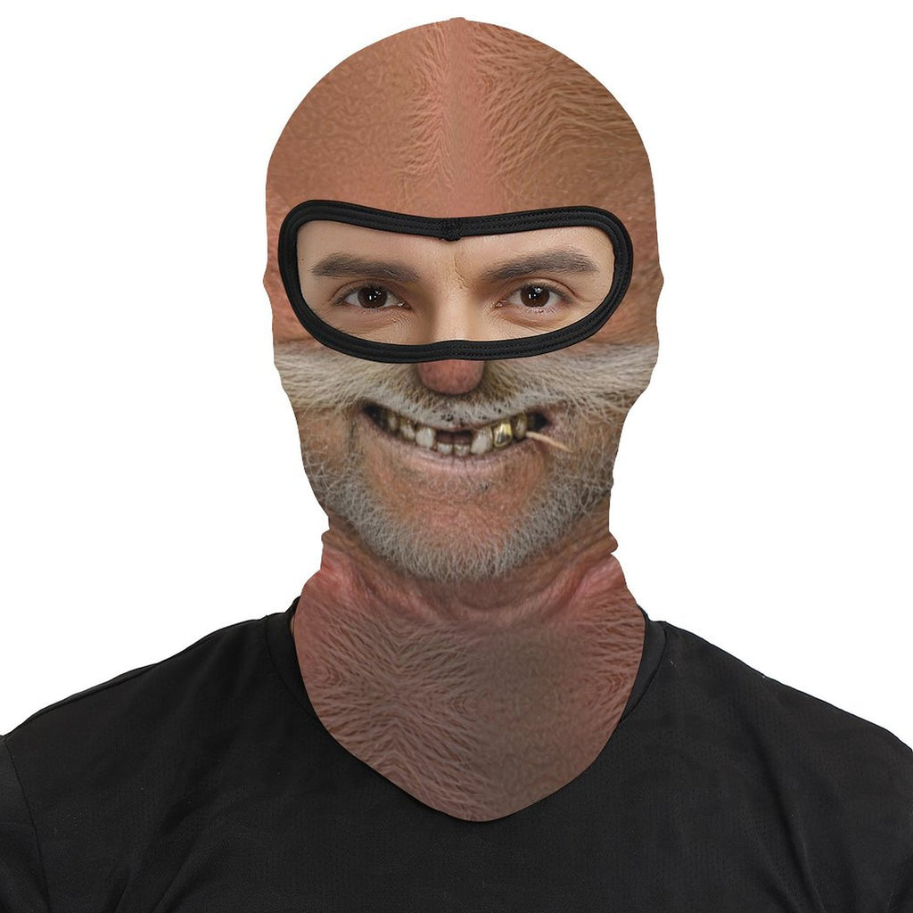 Big Stache Bubba funny face balaclava, printed white handlebar mustache and gold tooth, worn by a man, front view, eyes visible through the open eye band