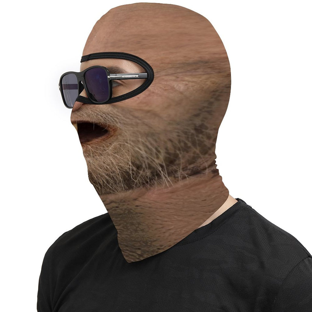 One Tooth Willie funny face balaclava, printed dropped jaw, one tooth and scruffy beard, worn with sunglasses, side profile