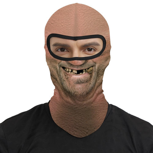 Toothless Tom funny face balaclava, printed gap-toothed grin, worn by a man, front view, eyes visible through the open eye band