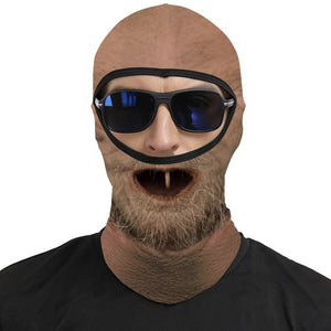 One Tooth Willie funny face balaclava, printed dropped jaw, one tooth and scruffy beard, worn with blue sunglasses over the open eye band, front view