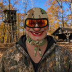 Gold Tooth Granny balaclava worn at a hunting camp in fall, camo scarf print and gold tooth grin
