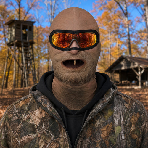 One Tooth Willie funny face balaclava worn with orange mirror sunglasses at a hunting camp