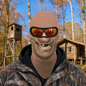 Toothless Tom full face balaclava worn with orange goggles over the eye opening, printed nose and gap-toothed grin, hunting camp